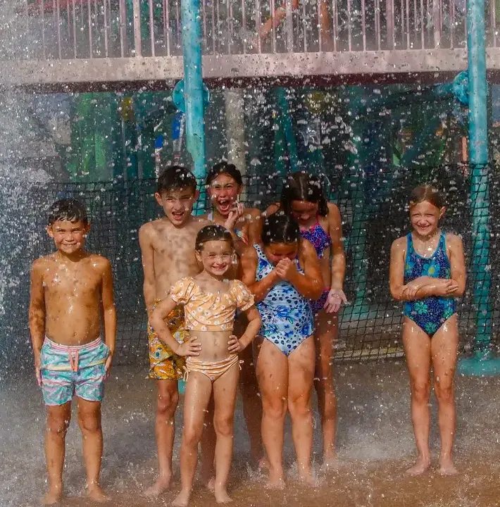 Kids playing in water at Mansfield park