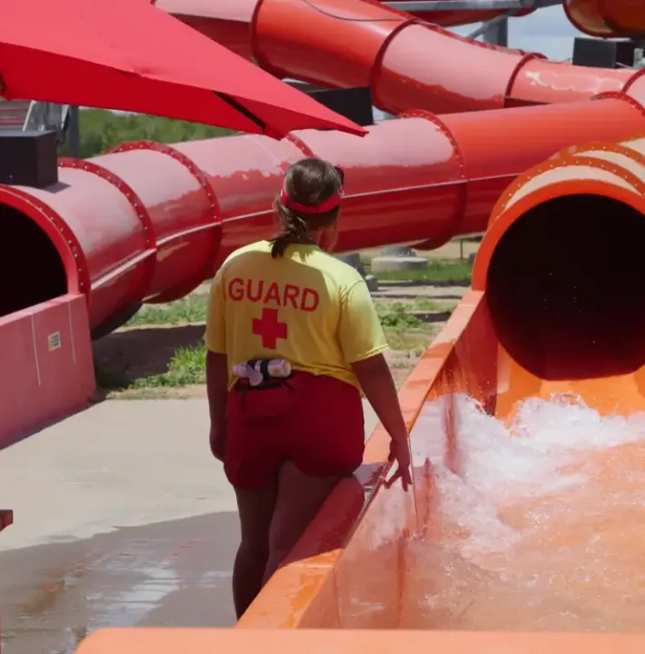 Family going down slide at Hawaiian Falls