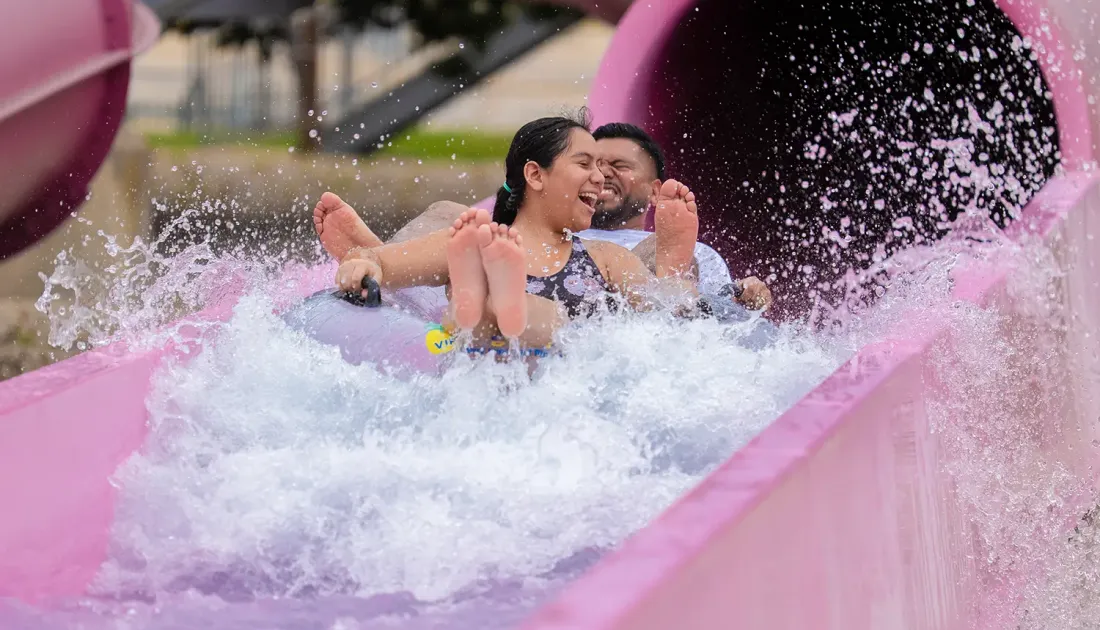 Family going down slide at Hawaiian Falls Mansfield location
